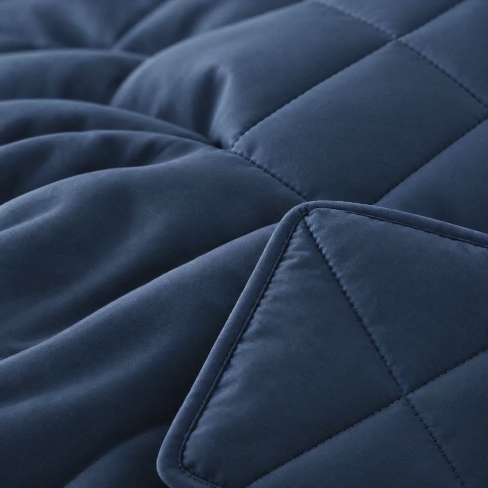 Hand running across the soft diamond stitched quilt